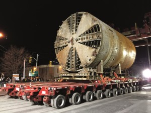 Moving one of the four massive boring machines required an equally large flatbed truck to handle the extreme load.