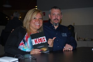 Author Suzanne Bernier (left) and driller Brandon Fisher (right) at the book signing for Disaster Heroes, which took place at the conclusion of Brandon Fisher’s presentation at Cambrian College in Sudbury.