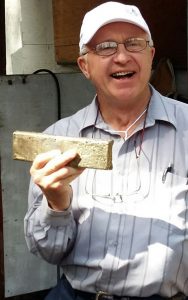Golden Predator director Brad Thiele with the first gold bar poured from the bulk sample of the Ace of Spades vein at the 3 Aces project.