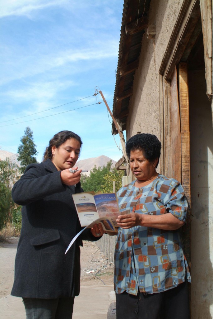 A Barrick employee discusses Pascua-Lama with a local resident during a door-to-door public information campaign. (Photo: Barrick Gold)