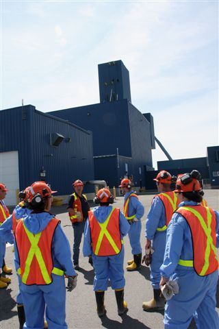 Teachers prepare to go underground at Xstrata's Nickel Rim South mine.
